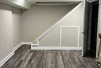 Custom Basement With Hidden Storage Under Stairs Custom Basement With Hidden Storage Under Stairs