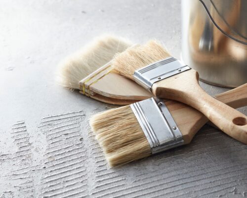 painting 3 paint brushes and a pint can